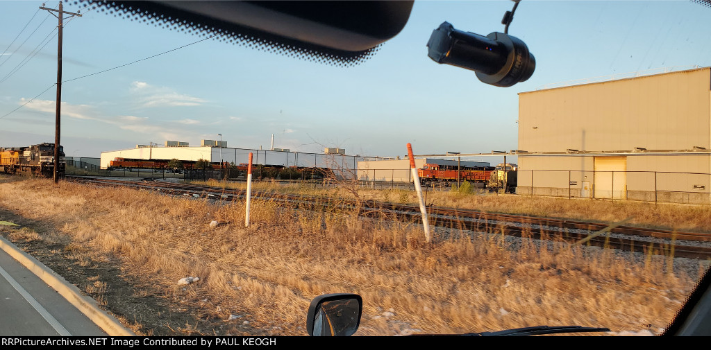 BNSF 3666, A Primered ES44ACH waiting to Be Painted, with BNSF 3667, 3668, and 3670 Laced Up in the Background Waiting to be Delivered to The BNSF Railway. 